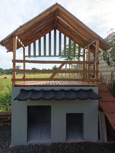 a dog house built into the side of a building