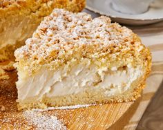 a piece of cake sitting on top of a wooden cutting board