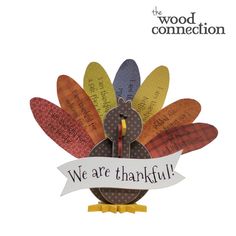 a turkey with a sign that says, we are thanks to the wood connection on it