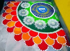 a colorful rangdi design on the ground