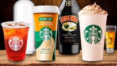 there are many different types of drinks on the table together, including starbucks's