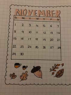 a november calendar with leaves and acorns on it