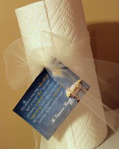 a roll of toilet paper with a card attached to it