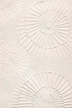 an abstract white wallpaper with three circular designs on the top and one circle in the middle