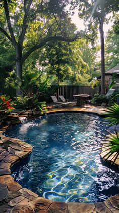 a small pool surrounded by lush green trees