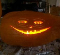 a carved pumpkin with glowing eyes and mouth