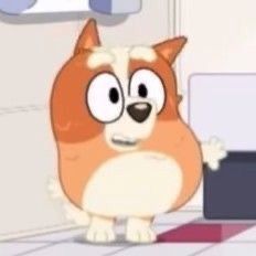 a cartoon dog standing in front of a laptop computer