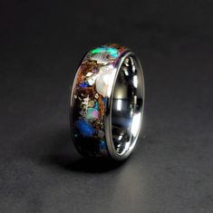 The Lunar Galaxy Rex™ Tyrannosaurus Rex Fossil/Bone, Lunar Meteorite NWA 5000, Nantan Meteorite, and Welo Opal with a Blue, Purple, and Pink Glow. This is really the ultimate wedding band and one of my personal favorites! RING INFORMATION Ring Name: Lunar Galaxy Rex™ Inlays: Tyrannosaurus Rex Fossil/Bone, NWA 5000 Lunar Meteorite, Nantan Meteorite, Welo Opal, Lab Opal Glow: Blue, Purple, and Pink Width: 4, 5, 6, 8, & 9 mm Sleeve: Tungsten Profile: Dome Finish: Polished Fit: Comfort Fit THE MATER Bone Wedding Ring, Lunar Meteorite, Rough Diamond Engagement Ring, Glow Ring, Tooth Ring, Meteorite Wedding Band, Fossil Bones, Meteorite Ring, Dinosaur Bones