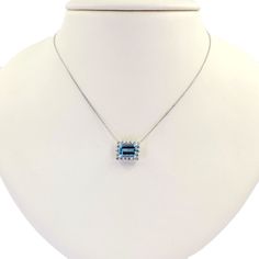 This necklace is crafted in 14 Karat white gold and features an emerald cut aquamarine totaling 1.07 Carats. Surrounding the aquamarine are 18 round brilliant cut diamonds of VS Clarity and G Color totaling 0.33 Carats. This necklace has an adjustable length measuring 15.5-16.5 inches long. Halo Pendant, Diamond Halo, Round Brilliant Cut Diamond, Brilliant Cut Diamond, Halo Diamond, Emerald Cut, Round Brilliant, Aquamarine, Diamond Cuts