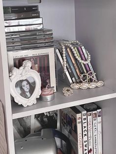 a book shelf filled with books and magazines