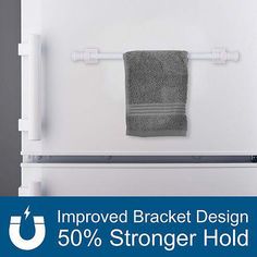 a towel hanging on the back of a refrigerator door with an advertise that reads, improve bracket design 50 % longer hold