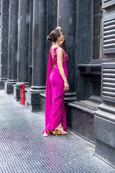 Look bold and elegant in this fusion of Saree Pants adorned with handworked zardozi, resham, dabka, sequins and mukesh to create a perfect symphony! Bright Magenta colored pure chiffon Saree, with a rawsilk blouse and cigarette pants. Hand Embellished Silk Pre-draped Saree, Festival Hand-embellished Pre-draped Saree, Bollywood Style Hand Embellished Evening Sharara, Bollywood Evening Hand Embellished Sharara, Diwali Festive Pre-draped Hand Embellished Saree, Bollywood Style Hand Embellished Floor-length Saree, Bollywood Style Hand Embellished Pre-draped Saree For Festivals, Bollywood Style Silk Sharara For Evening, Glamorous Designer Silk Choli