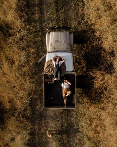 two people are in the back of a truck