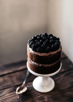 a chocolate cake sitting on top of a wooden table