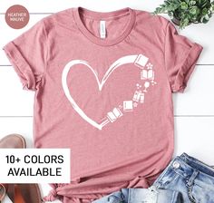 "This Heart Book shirt is the perfect birthday gift for any book lover! All of our shirts are made with the highest quality materials and are super soft and cozy! 💚 HOW TO ORDER 💚 1. Check our photos for sizing and color options. 📏 2. Choose your quantity. Feel free to add as many shirts as you wish! ✨ 3. Select your size and color from the drop-down menus. ✨ 4. Click \"ADD TO CART\" to add the shirt to your virtual cart. 🛒 5. Click \"PROCEED TO CHECKOUT\" to purchase your shirt. 🛒 6. Your Reading Tshirt, Bookworm Shirt, Book Shirt, Librarian Shirt, Teacher Teacher, Teacher Appreciation Gift, Book Shirts, Perfect Birthday Gift