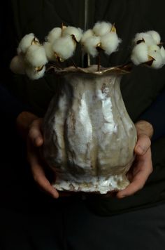 This white handmade ceramic vase showcases an elegant, organic form with a gently curved silhouette and a softly flared, wavy rim. Modern contemporary design. Verbivsky Ceramics studio. The surface features a stunning craquelure effect--a network of fine, crackled lines that create a unique texture and pattern, reminiscent of aged, antique pottery.  The glaze displays a subtle blend of earthy tones, including shades of cream, white, and soft browns, with natural variations that enhance its artisanal charm.  The vase's delicate, glossy finish catches the light beautifully, highlighting the intricate details of the crackled glaze.  This piece stands out as a timeless decorative accent, perfect for adding a rustic yet sophisticated touch to any space. * Handmade with love and care; * Unique, Aesthetic Interior Design, Handmade Ceramic Vase, Shades Of Cream, White Ceramic Vase, Ceramics Studio, Aesthetic Interior, Handmade Ceramics Vase, Texture And Pattern, Vase Handmade