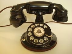 an old - fashioned telephone is sitting on a table