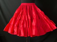 vintage red petticoat has loads of ruffles that flare this full circle crinoline and is perfect to puff out any day dress, party dress or square dance ensemble!! elastic waist with a 5" velcro band for an adjustable fit. ✂ measurements ✂ waist: 28" to 34" length:  19" label / maker:  million dollar petticoats condition: very good.  no stains, tears or major flaws to note. Bridge City, Square Dance, Square Dancing, Label Maker, Million Dollar, Full Circle, Day Dress, Dress Party, Design Awards