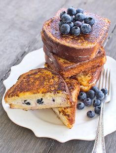 french toast with blueberries on a white plate