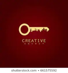 a golden key with the word creative on it and an image of a city in the background