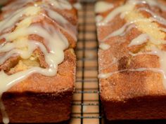 two loaves of bread with icing on a cooling rack