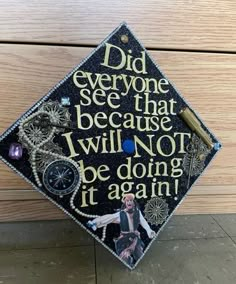 a graduation cap with words and pictures on it