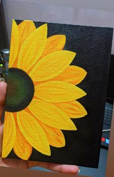 a painting of a sunflower being held up