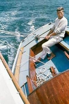 a man sitting on the bow of a boat