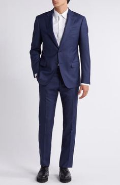 Classic and smart, this wool suit styled in a dark-blue mélange features traditional detailing that makes it a versatile addition to any formal wardrobe. Jacket has notched lapels; chest welt pocket; flap pockets; side vents Trousers have zip fly; slant pockets; back button-welt pockets Jacket is lined; trousers are lined to the knee 100% virgin wool Dry clean Imported Elegant Tailored Blue Double Breasted Suit, Elegant Tailored Blue Double-breasted Suit, Elegant Blue Suit In Suiting Fabric, Elegant Blue Double Breasted Suit For Semi-formal Events, Elegant Blue Collared Suit, Elegant Blue Three-piece Suit For Semi-formal Occasions, Elegant Blue Semi-formal Three-piece Suit, Elegant Tailored Navy Double Breasted Suit, Elegant Navy Double Breasted Suit With Suit Collar