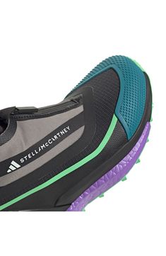 Step into a trail-ready hiking shoe with a partially recycled design. Enjoy enhanced comfort, a Gore-Tex® shield and a snug fit. This sneaker is perfect for hikers who crave top-notch performance. 3 1/2" heel ( size 8.5) 4" shaft Gore-Tex waterproofing provides all-condition dryness removable insoles Textile and synthetic upper/textile lining/synthetic sole Imported Dynamic Running Shoes With Reflective Details For Trail, Black Running Shoes For Trail Running With Reflective Details, Black Running Shoes With Reflective Details For Trail, Functional Green Trail Running Shoes For Outdoor, Functional Green Trail Running Shoes For Outdoor Activities, Dynamic Trail Running Shoes With Reflective Details, Purple Trail Running Shoes With Boost Midsole, Sporty Green Running Shoes For Hiking, Green Trail Running Shoes With Air Cushioning For Hiking