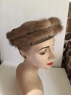 "Vintage 1950's 1960's Mink and Velvet Ringlet hat. Has a Satin bow in the back. No makers label or tag. Open crown style hat. *MORE INFORMATION BELOW* CONDITION: No issues noted. MEASURES: Inside circumference~21\" Height~2 1/2\" Front to back~8\" Left to right~7\" *WE APOLOGIZE~BUT WE NO LONGER SHIP TO GERMANY, ITALY OR SPAIN. IF ORDERS COME IN FROM GERMANY, ITALY OR SPAIN, WE WILL HAVE TO CANCEL THEM AND REFUND YOUR MONEY. SORRY FOR THIS INCONVENIENCE*" Vintage Adjustable Fascinator Headband, Vintage Mini Hat Headband For Vintage Events, Vintage Formal Headband Costume Hat, Vintage Formal Costume Headband, Vintage Evening Fascinator Headband, Vintage Fascinator Headband For Church, Vintage Church Fascinator With Headband Shape, Vintage Church Fascinator Headband, Vintage Headband Fascinator For Church