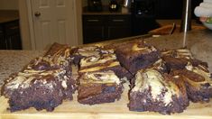 some brownies are sitting on a cutting board