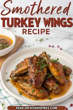 a white plate topped with chicken wings covered in gravy