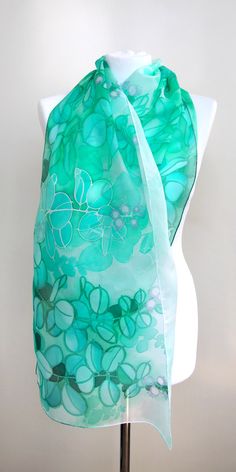 Jade silk scarf, hand paint with silk paint in green and turquoise shades on white. Size: 61 by 17 inches Silk: pure Habotai Light, semi transparent and a bit glossy This long, light scarf is ready to be shipped! It is hand painted with special silk paints that can be washed (for silk sake, please wash by hand! I am attaching an easy-to-follow instruction). The scarf won't fade! On this white and green silk wrap I have painted jade plant (you know it? Super popular indoor Crassula plant that bri Artistic Hand Painted Green Silk Scarf, Artistic Hand Dyed Green Silk Scarf, Hand Painted Green Silk Scarf, Artistic Green Silk Scarf As A Gift, Handmade Green Bohemian Silk Scarf, Artistic Hand-dyed Green Scarves, Green Bohemian Silk Scarf As Gift, Green Bohemian Silk Scarf For Gift, Handmade Bohemian Green Silk Scarf