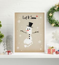 a christmas card with a snowman wearing a top hat and the words, let it snow