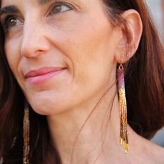 a close up of a person wearing earrings