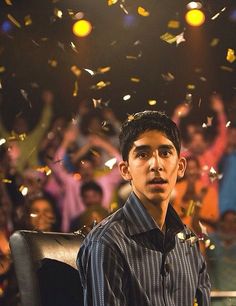 a young man is surrounded by confetti and streamers