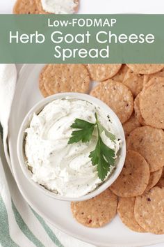 low - fodmap herb goat cheese spread on a plate with crackers