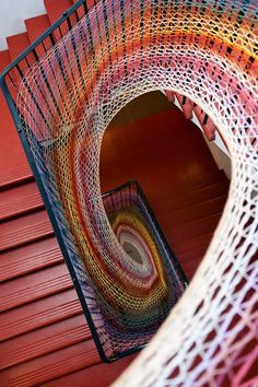 there is a spiral staircase made out of yarn