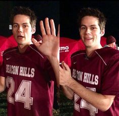 two men in maroon jerseys are holding their hands up and making the number four sign