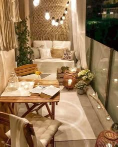 an outdoor living area is lit up with string lights and wicker decorating the walls