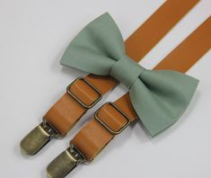 Sage green linen ties/bow tie/ with PU leather suspenders for wedding, party... Important: Please remark the style of bow tie CLIP ON or Ribbon in the note when you place order. All wood bow ties will be ribbon style and please remark the wood style in the note when you place order. If you order the set, please remark the color of suspenders in the note. Thank you! Size of linen tie: Adult L&XL: Length is 57'' and width is 3.1'' Sizes of linen bow tie are as following: XS for boy: Newborn-2Y Sage Green Bow Tie And Suspenders, Sage Green Bow Tie Groomsmen, Sage Green Groomsmen Attire, Sage Bow Tie, Sage Green Bow Tie, Sage Green Wedding Theme, Sage Wedding Colors, Sage Green Wedding Colors, Groomsmen Suspenders