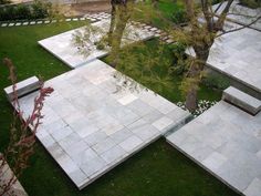 an outdoor area with stone steps and trees