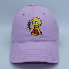 The Simpsons 'Lisa Simpson With Flower' Strap-Back Hat. New With Tag In Great Condition. Cute Summer Hats With Curved Bill, Cute Spring Hat With Curved Bill, Cute Curved Bill Hat For Spring, Adjustable Short Brim Dad Hat For Spring, Spring Adjustable Dad Hat With Short Brim, Cute Dad Cap For Spring, Cute Dad Hat For Spring, Purple Summer Snapback Hats, Summer Purple Baseball Cap