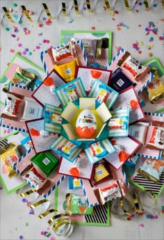 an overhead view of many different items on a table with confetti and streamers