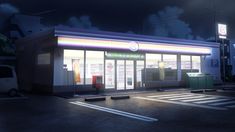 an empty gas station at night with the lights on