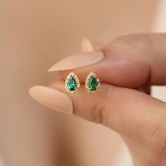 Discover timeless elegance with our handcrafted 14K solid gold earrings, featuring genuine diamonds and vibrant emerald gemstones, the birthstone for May. These luxurious drop stud earrings are meticulously designed to offer both style and sophistication. Each piece is carefully created with the highest quality materials, ensuring that you receive a product not only beautiful but also durable. Dimensions for these exquisite earrings are thoughtfully chosen to enhance aesthetic appeal while provi Green Diamond Earrings For Anniversary, Green Teardrop Diamond Earrings For Anniversary, Fine Jewelry Emerald Pear-shaped Earrings, Pear-shaped Emerald Earrings Fine Jewelry, Emerald Yellow Gold Diamond Earrings Fine Jewelry, Emerald Yellow Gold Diamond Earrings, Fine Jewelry Green Diamond Earrings For Gift, Fine Jewelry Green Diamond Earrings As Gift, Green Gemstone Diamond Earrings For Gift