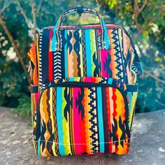 The Aztec Warrior Diaper Bag is very roomy and bright and beautiful. This bag has multiple zipper pockets and cubbies to put necessities. 13" L X 8" W Multicolor Rectangular Shoulder Bag For Outdoor, Multicolor Tote Bag For Outdoor, Multicolor Backpack Shoulder Bag For Outdoor, Multicolor Backpack With Zipper Pocket, Multicolor Shoulder Backpack With Zipper Closure, Multicolor Shoulder Bag Backpack With Zipper, Multicolor Shoulder Bag Backpack With Zipper Closure, Multicolor Bags With Zipper Pocket For Trips, Large Capacity Multicolor Shoulder Bag For Outdoor