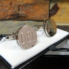 "Classy is the name of the game with our handsome Pin Stripe personalized cuff links. These round silver-toned cufflinks include a thin black inset stripe around the perimeter and a classic shank design. Measures 5/8\" (diameter) by 1\" in length. Cuff links come complete with gift box. The pin stripe personalized cuff links are high quality and makes great groomsmen gifts and men's gifts. Please leave initials to be engraved in the Notes to seller box during checkout. Customers who viewed this Personalized Tie Clip, Men's Gifts, Groom Cufflinks, Personalized Tie, Leather Money Clips, Personalized Cufflinks, Norman Reedus, Father Of The Bride, Discount Price