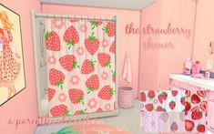 a pink bathroom with strawberry themed shower curtain